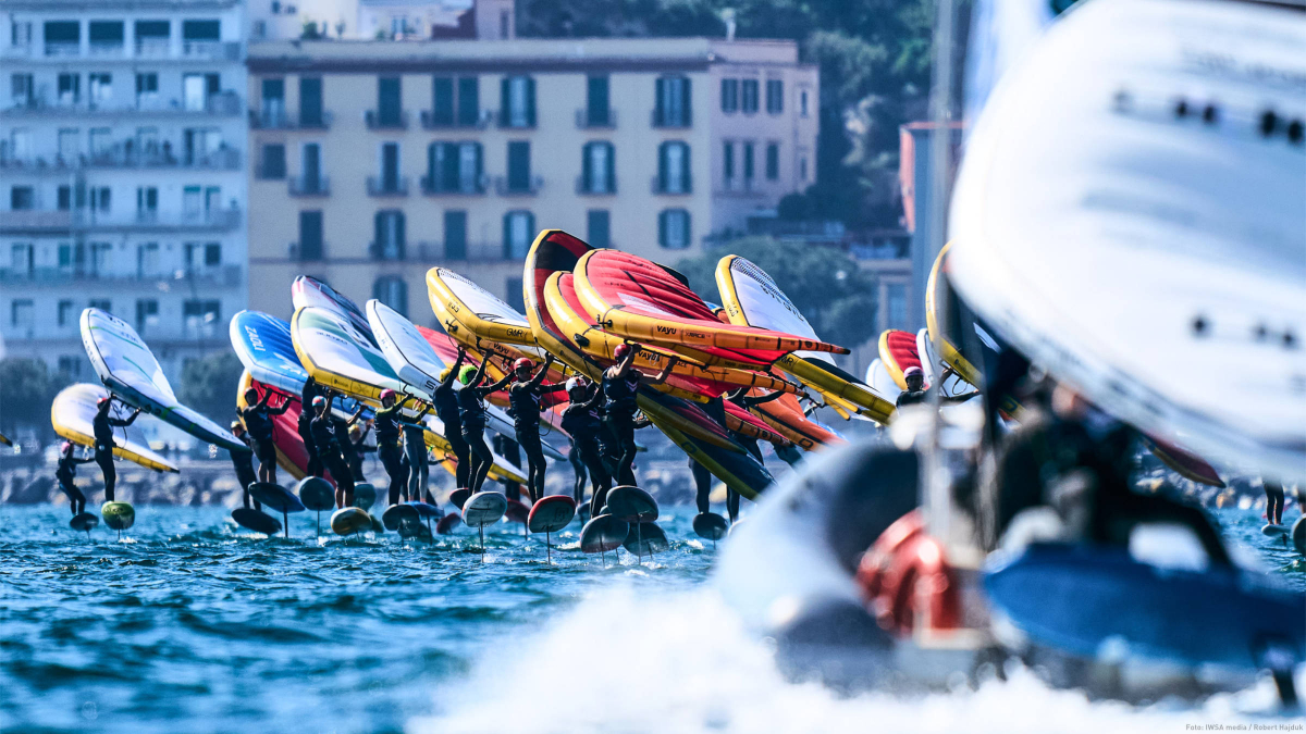 Seconds before the start of a race, the wing foilers are lined up at the starting line